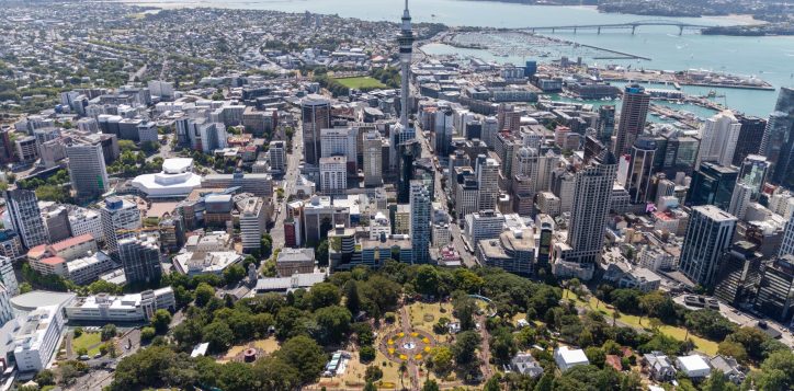 aerial-image-of-auckland-city-with-albert-park-skytower-and-harbour-bridge-visible-with-city-buildings-and-ocean-visible-2
